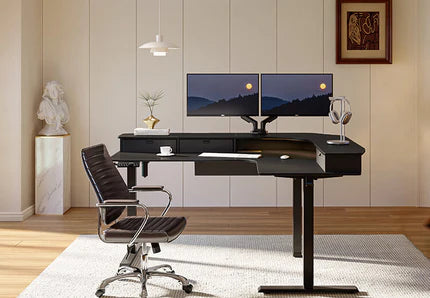 A modern office setup with a black desk, dual monitors, a chair, and decorative items in a cozy room.