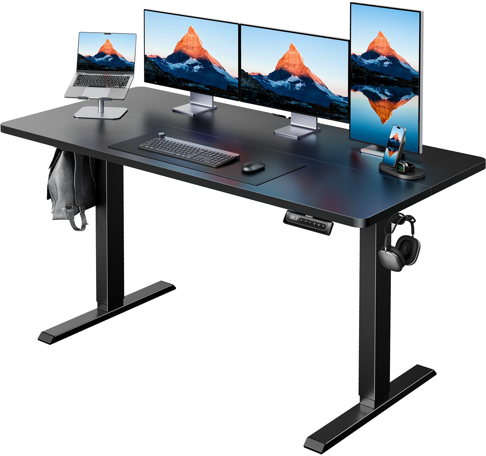 HUANUO electric standing desk with three monitors, laptop, and organized workspace accessories.