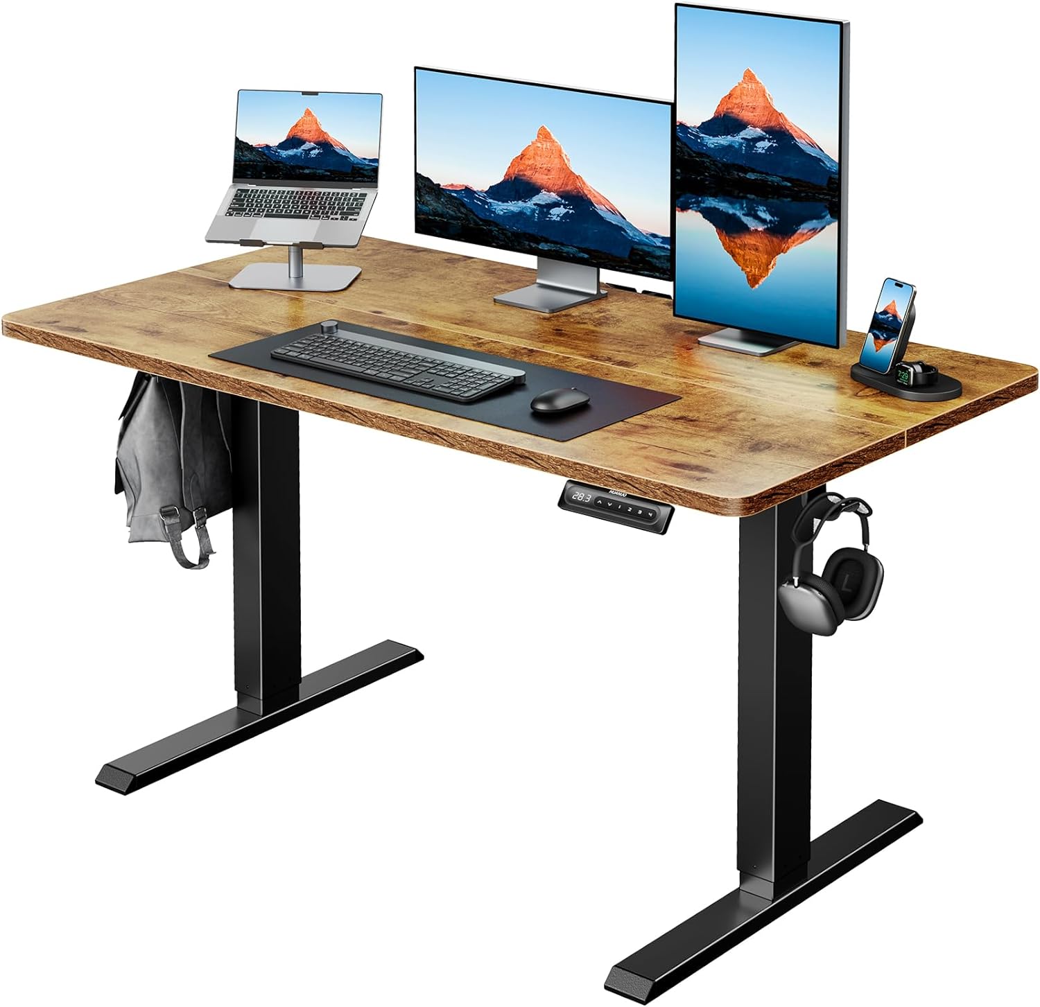 HUANUO electric standing desk with dual monitors, laptop, and modern accessories.