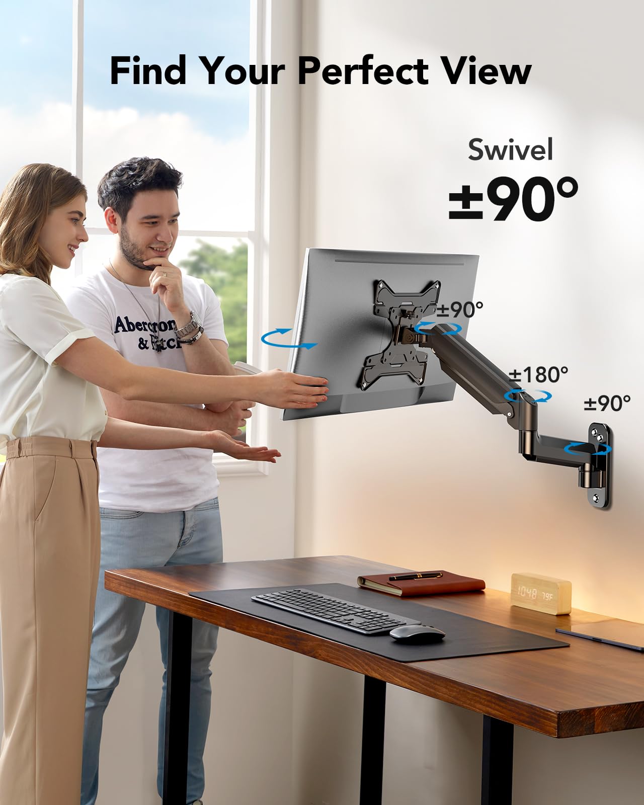 Couple adjusting HUANUO monitor mount for optimal viewing angles in ergonomic workspace