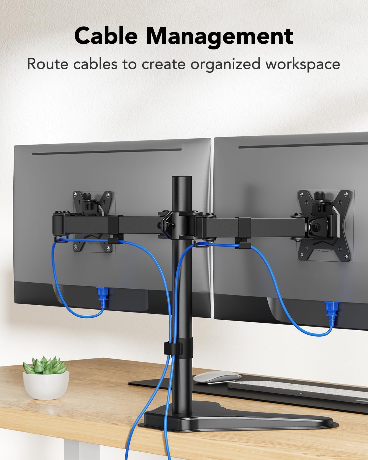 Dual monitor mount with organized cables for a neat workspace setup.