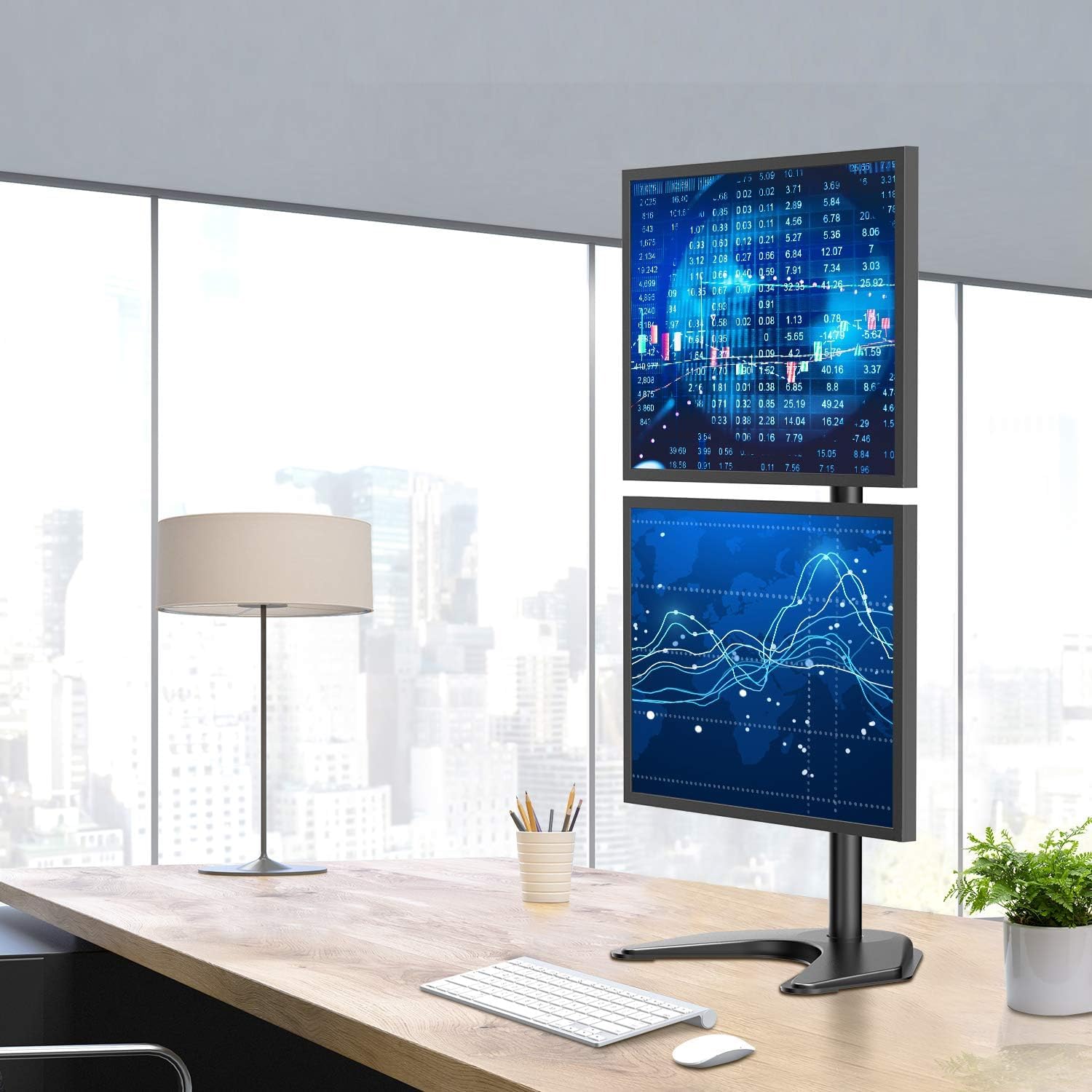Dual monitor stand displaying data screens in a contemporary office