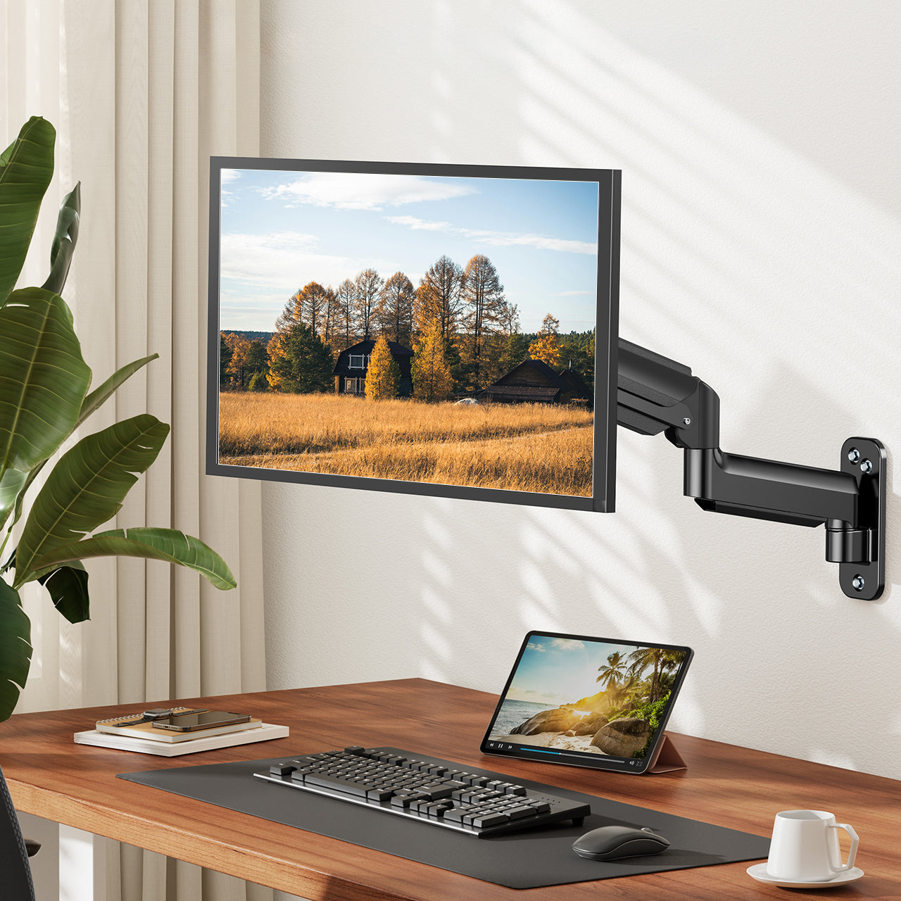Flexible HUANUO monitor arm holding 27-inch display in ergonomic workspace setup