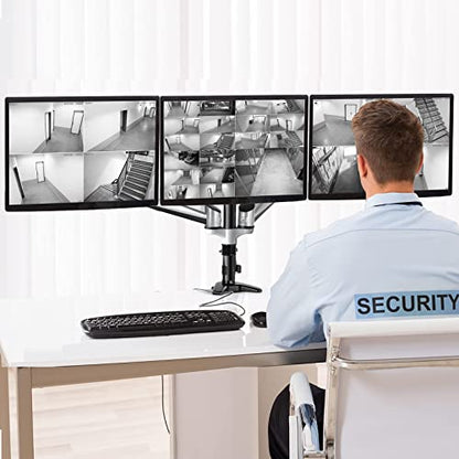 Security professional using HUANUO Triple Monitor Stand with three screens for surveillance.