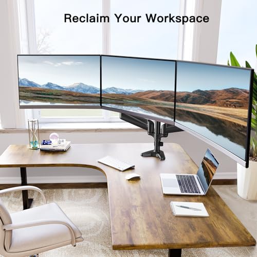 Triple monitor setup on desk with HUANUO mount, displaying scenic landscape view.