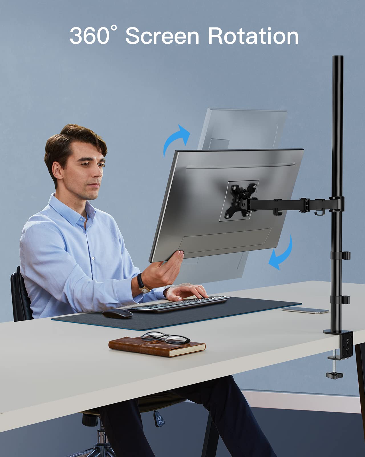 Man adjusting a monitor's 360° rotation on an ergonomic mount.