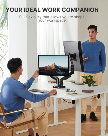 Man demonstrating HUANUO dual monitor mount flexibility in a modern workspace.