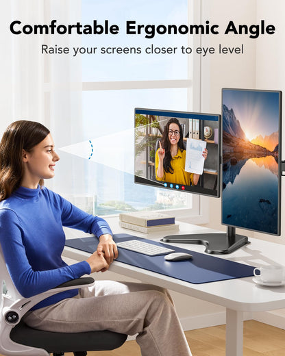 User with dual monitors set at an ergonomic angle for comfortable viewing.