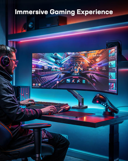 User gaming with HUANUO monitor arm holding a 49-inch ultrawide screen.