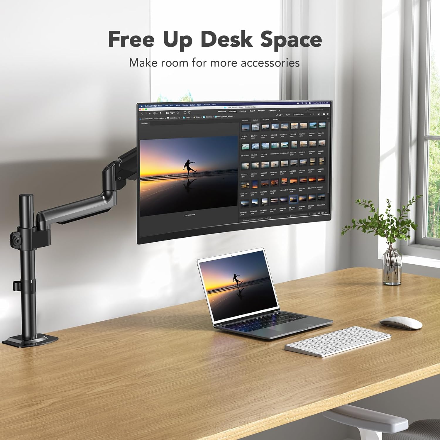 HUANUO monitor mount freeing desk space for additional accessories.