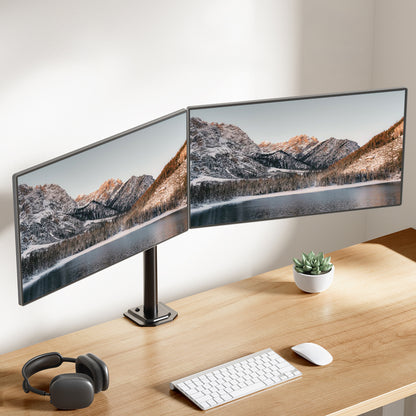 HUANUO dual monitor mount displaying two screens in an ergonomic workspace.