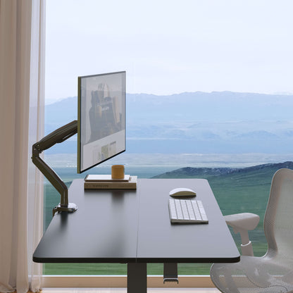 Adjustable HUANUO monitor arm with scenic view and modern office setup