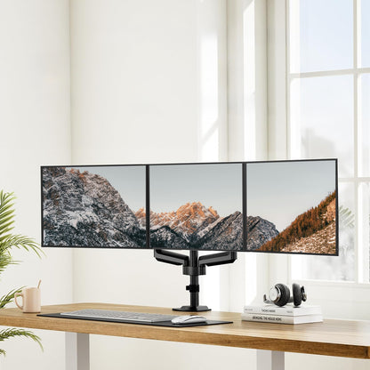 Triple monitor mount displaying three screens in a modern workspace.